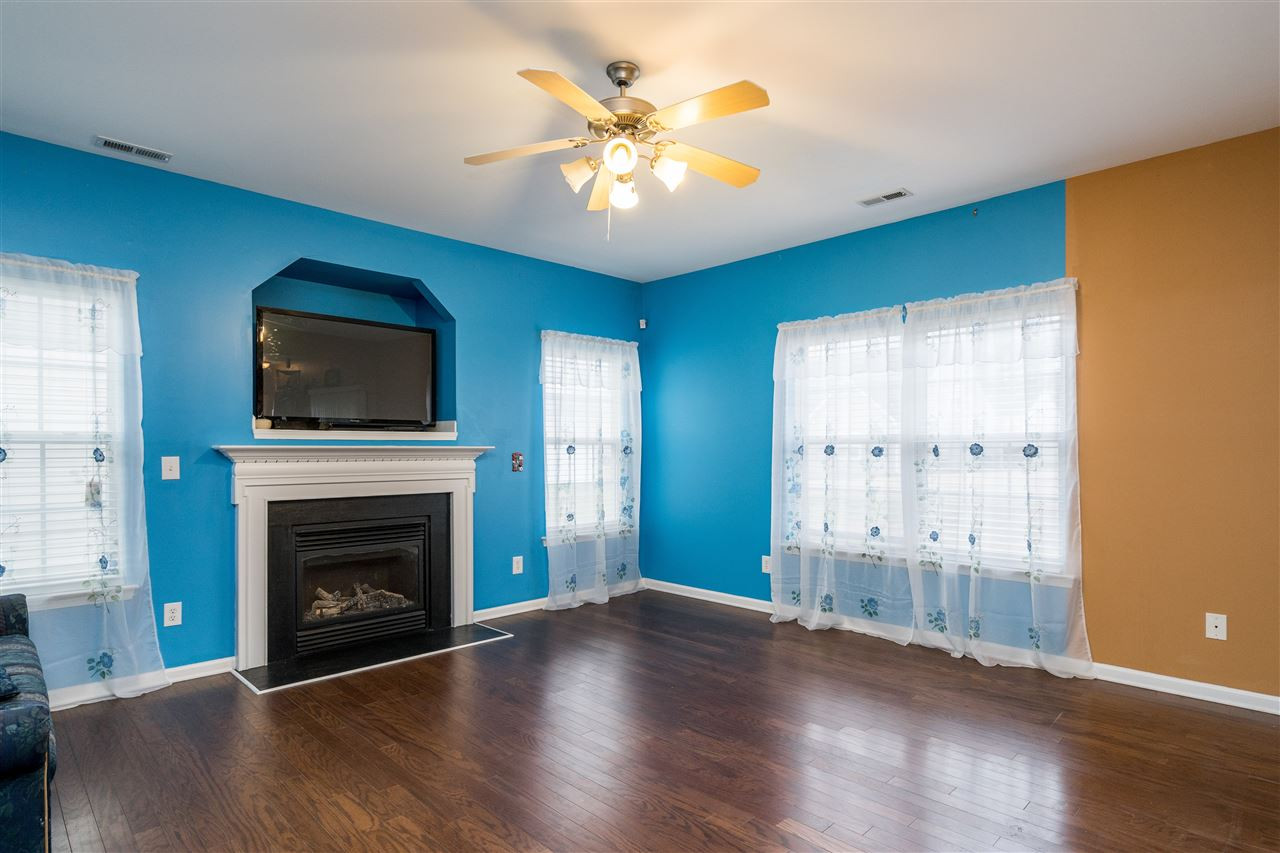 3130 Rendezvous Drive Raleigh, NC 27610 - Photo 12 of 22 a view of an empty room with a fireplace and a window