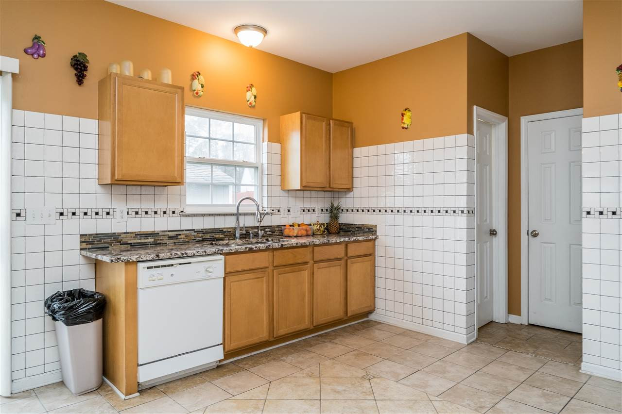3130 Rendezvous Drive Raleigh, NC 27610 - Photo 6 of 22 a bathroom with a granite countertop sink and a mirror