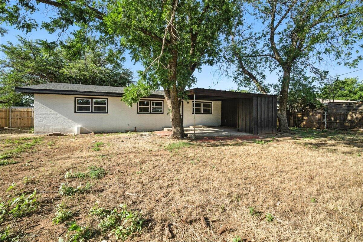 1308 59th Street Lubbock, TX 79412 - Photo 28 of 28 a house with trees in front of it