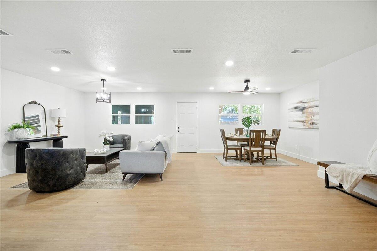 1308 59th Street Lubbock, TX 79412 - Photo 4 of 28 a living room with furniture and wooden floor