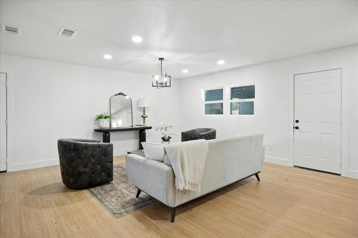 1308 59th Street Lubbock, TX 79412 - Photo 5 of 28 a living room with furniture and a window