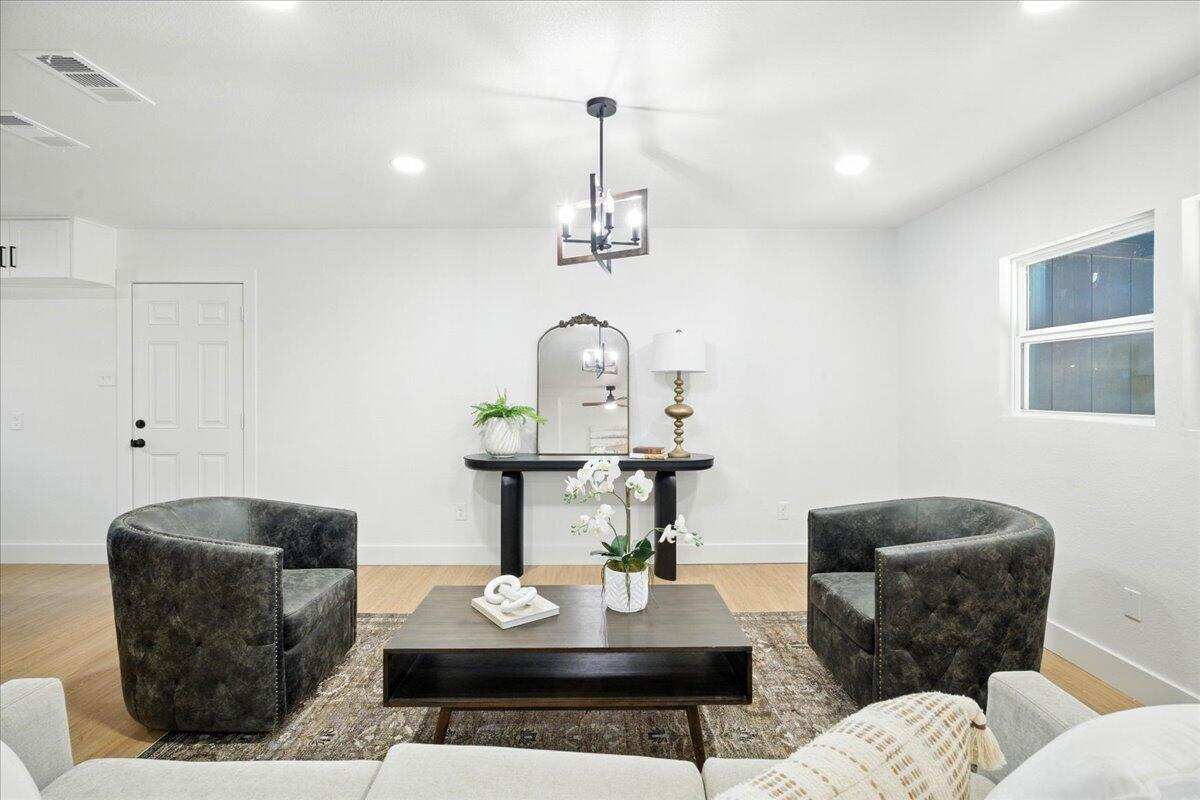 1308 59th Street Lubbock, TX 79412 - Photo 6 of 28 a living room with furniture a rug and a table