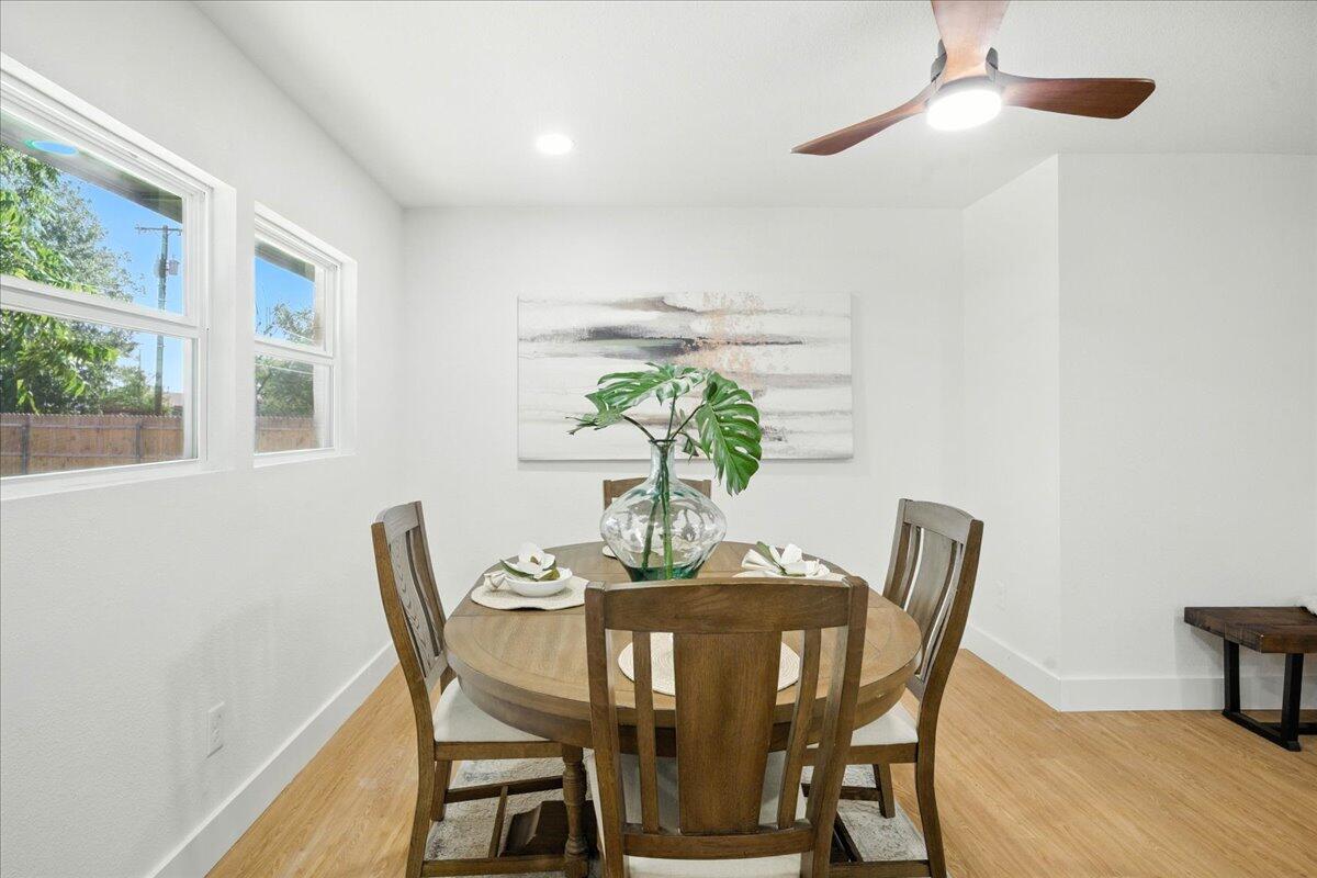 1308 59th Street Lubbock, TX 79412 - Photo 10 of 28 a dining room with furniture and wooden floor