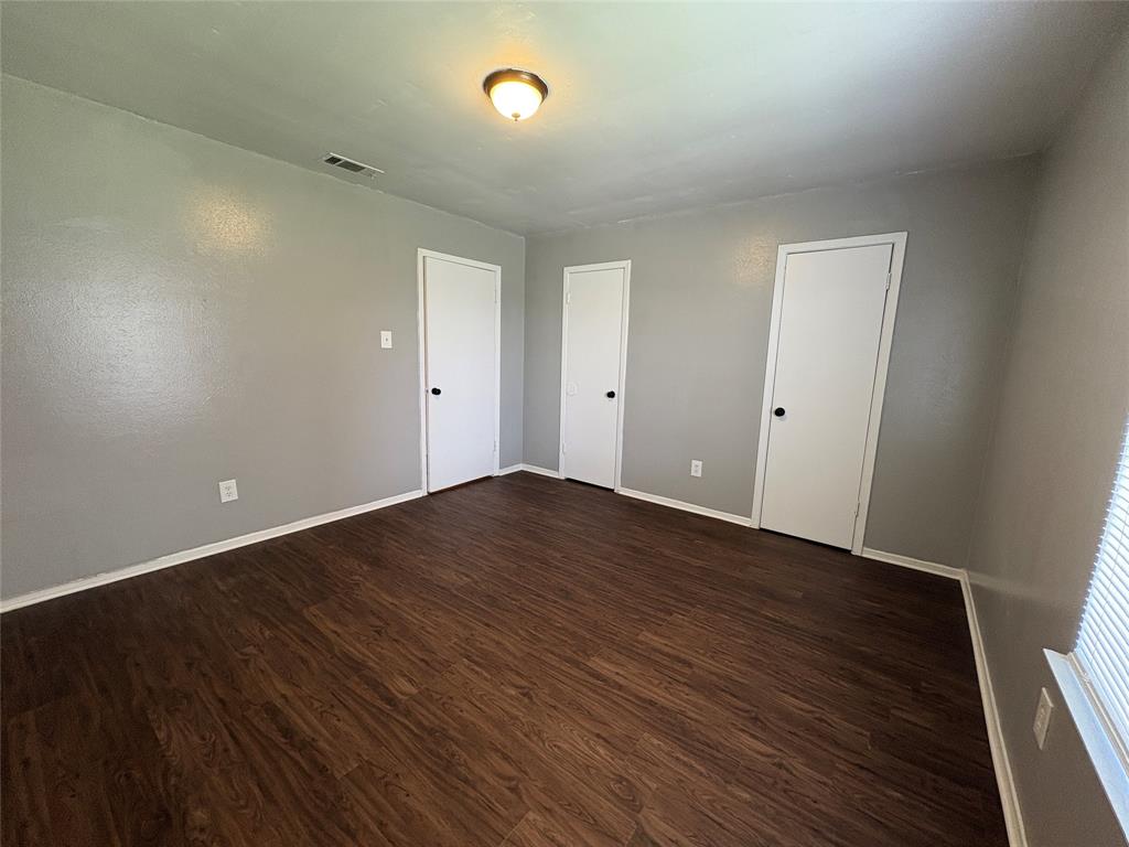 1702 Short Street, Unit C Cleburne, TX 76033 - Photo 4 of 9 a view of empty room with wooden floor