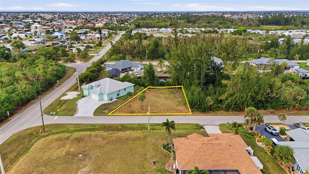 3925 Magnolia Way Punta Gorda, FL 33950 - Photo 2 of 4 an aerial view of a house with a yard and lake view