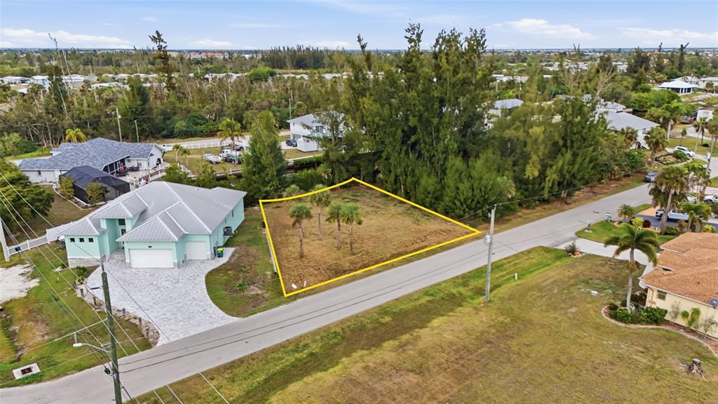 3925 Magnolia Way Punta Gorda, FL 33950 - Photo 3 of 4 an aerial view of residential houses with outdoor space and street view