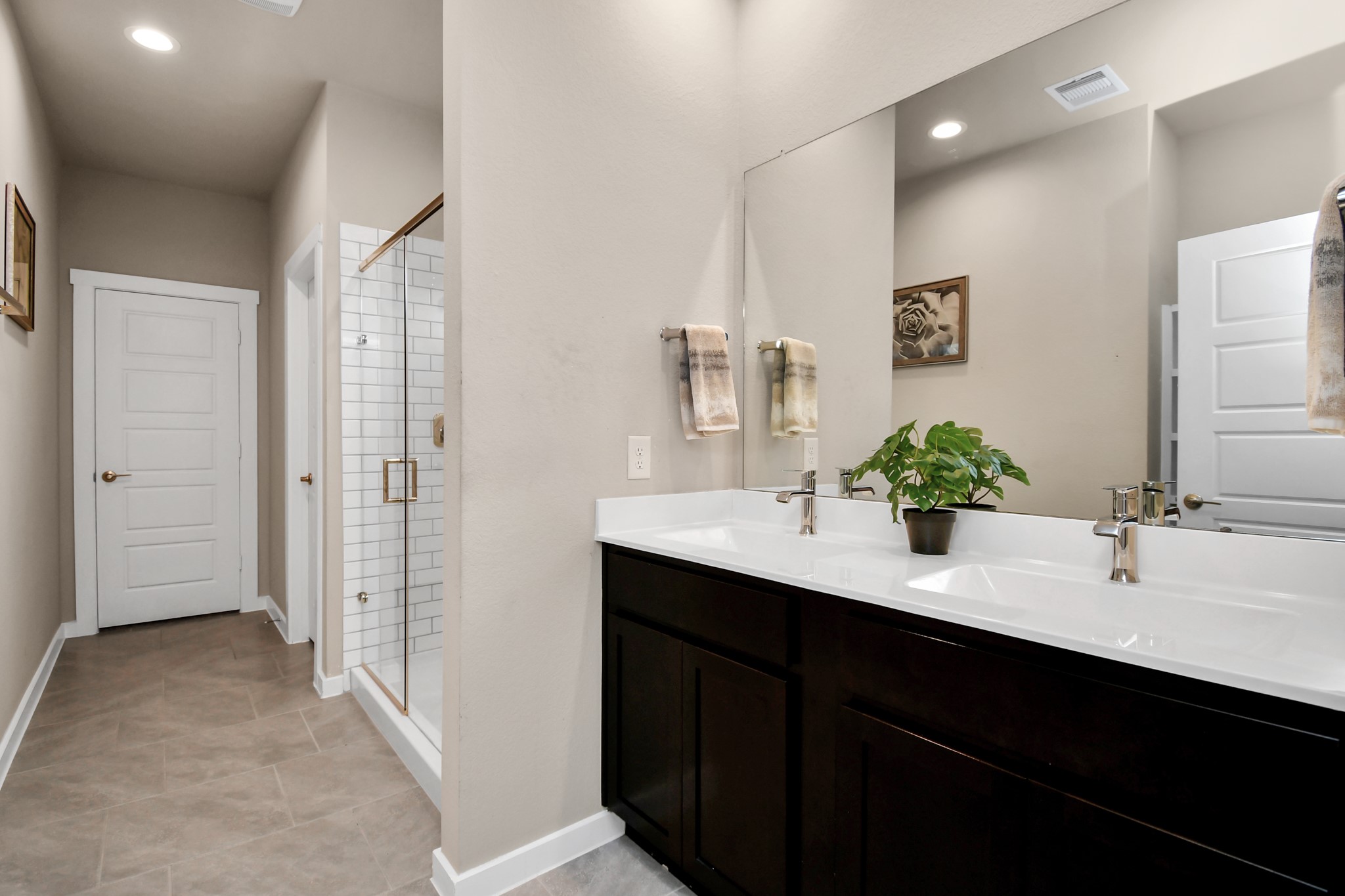 12505 Walmgate Court Houston, TX 77047 - Photo 18 of 31 The primary bathroom features dual sinks and stand up shower