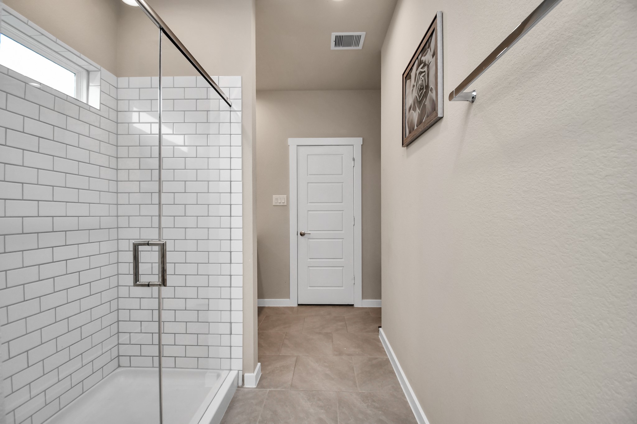 12505 Walmgate Court Houston, TX 77047 - Photo 19 of 31 The luxury primary bath includes a stand up shower with subway tile