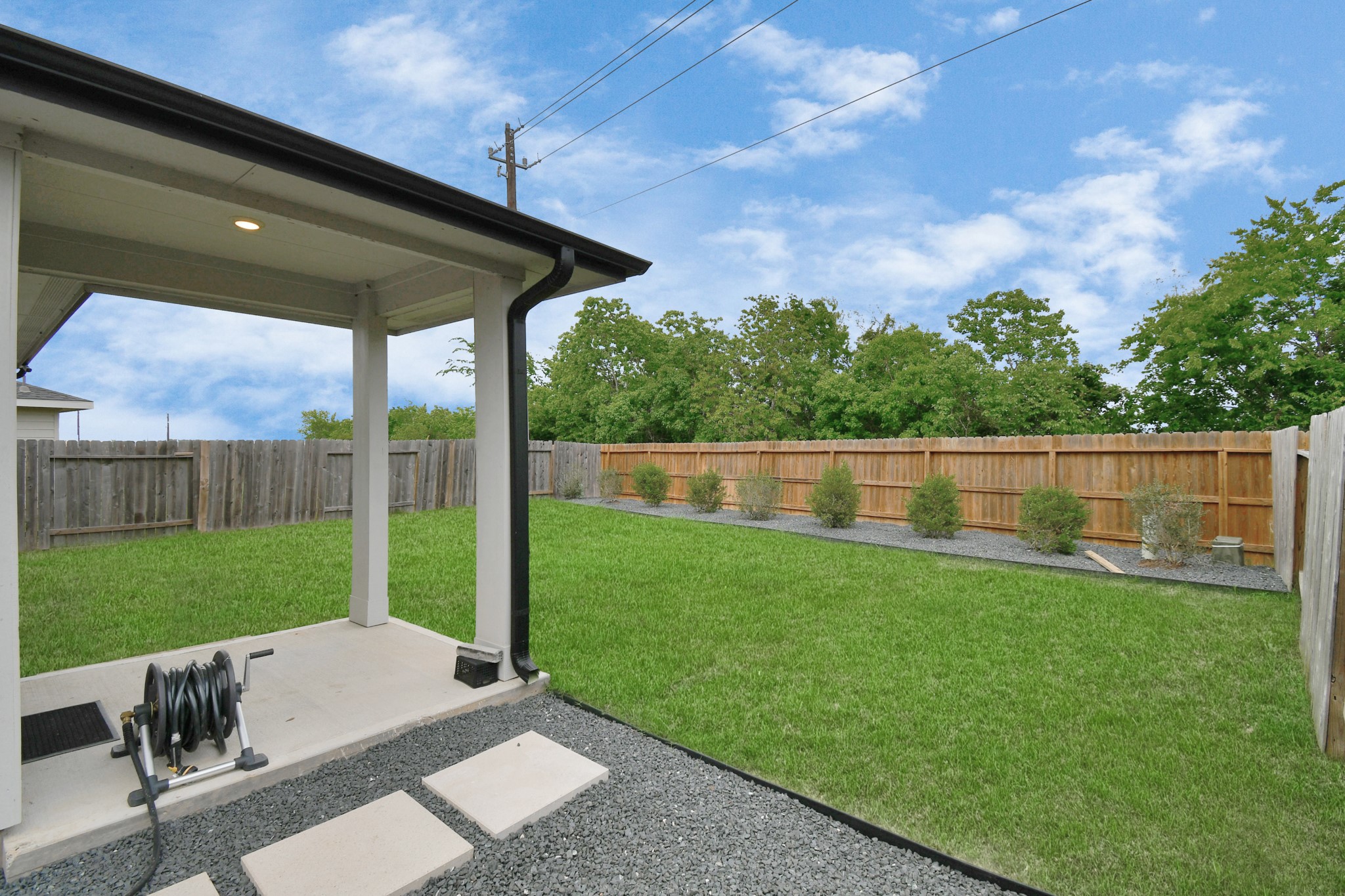 12505 Walmgate Court Houston, TX 77047 - Photo 26 of 31 The backyard features a gravel walkway with stepping stones for an additional luxury touch!