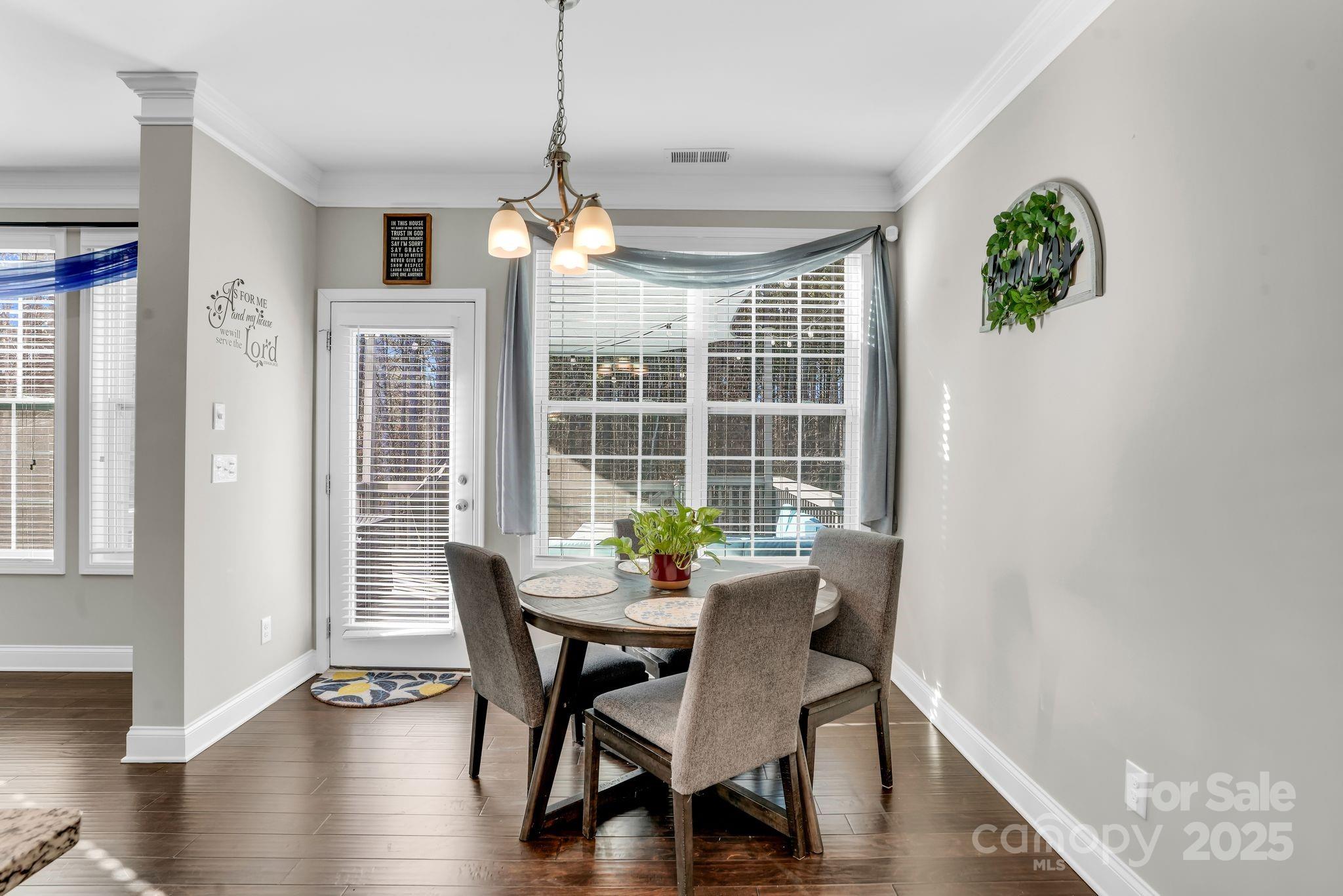 9507 Inverness Bay Road Charlotte, NC 28278 - Photo 11 of 29 a view of a dining room with furniture window and wooden floor