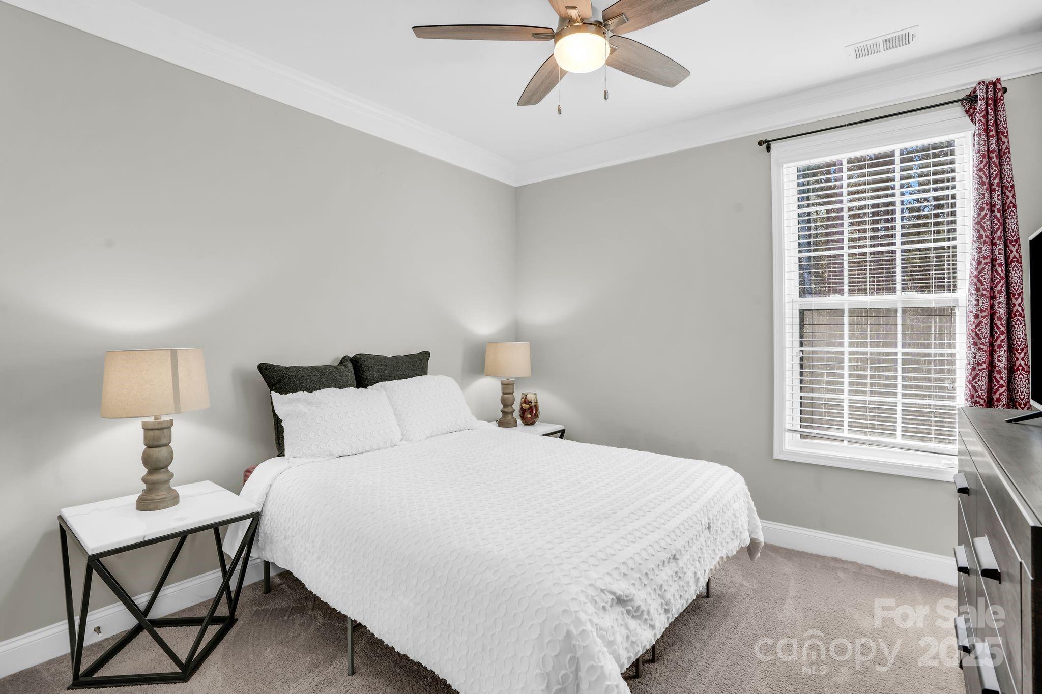 9507 Inverness Bay Road Charlotte, NC 28278 - Photo 12 of 29 a bedroom with a bed and window