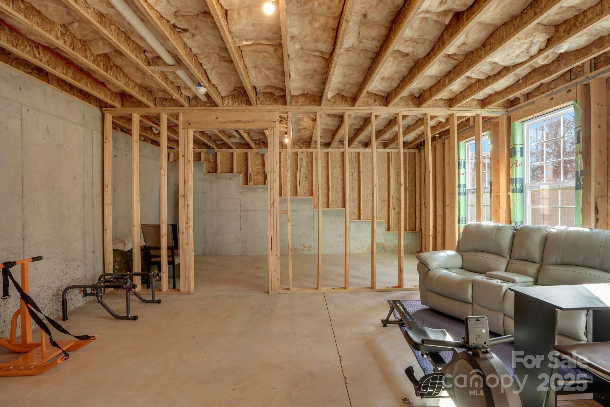 9507 Inverness Bay Road Charlotte, NC 28278 - Photo 22 of 29 a livingroom with furniture and floor to ceiling window
