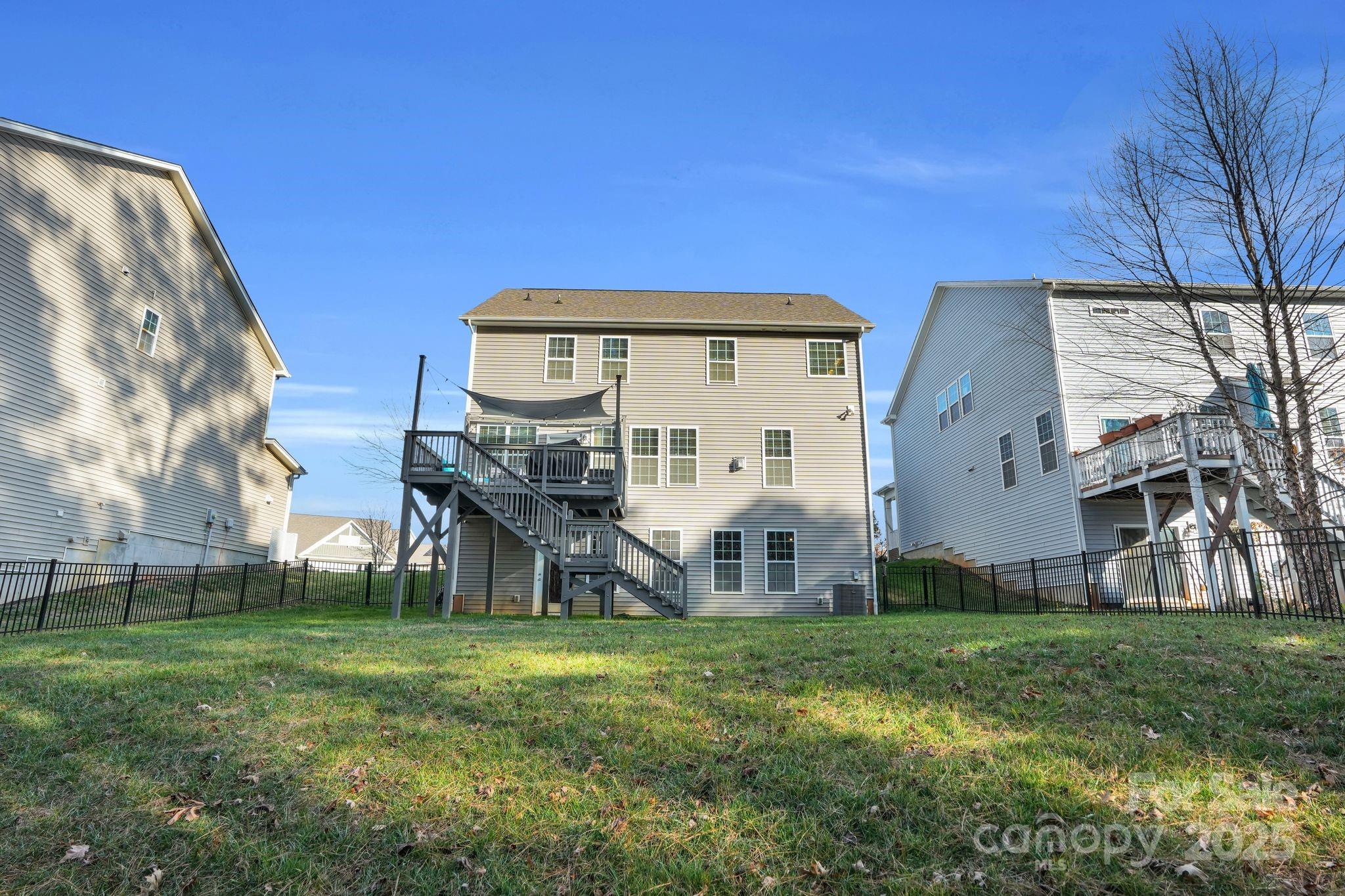 9507 Inverness Bay Road Charlotte, NC 28278 - Photo 25 of 29 a view of a house with a yard