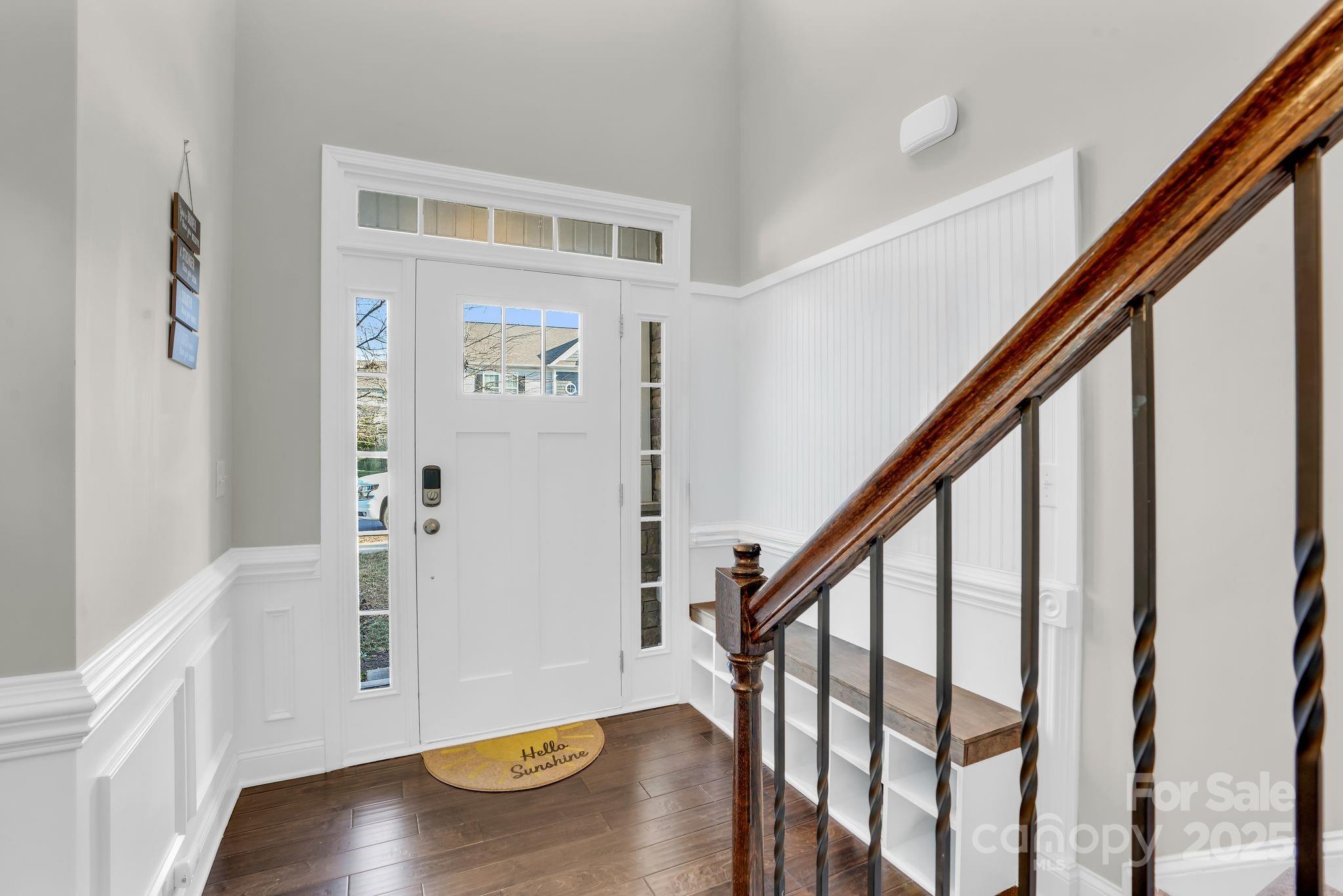 9507 Inverness Bay Road Charlotte, NC 28278 - Photo 3 of 29 a view of entryway with wooden floor and stairs