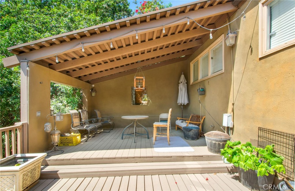 7241 Old Temescal Road Corona, CA 92881 - Photo 21 of 47 a view of a patio with couches table and chairs and potted plants