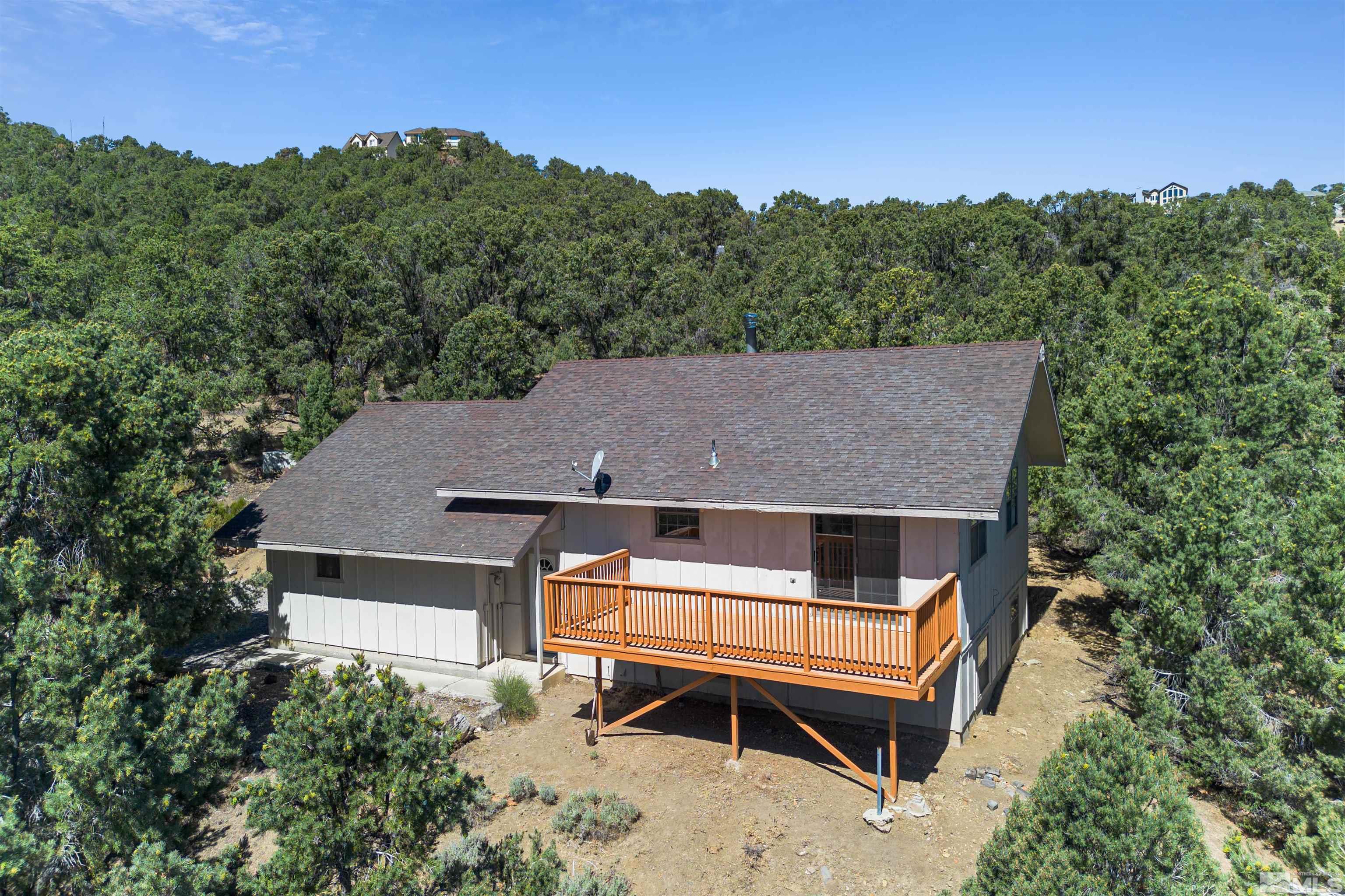 an aerial view of a house with a balcony