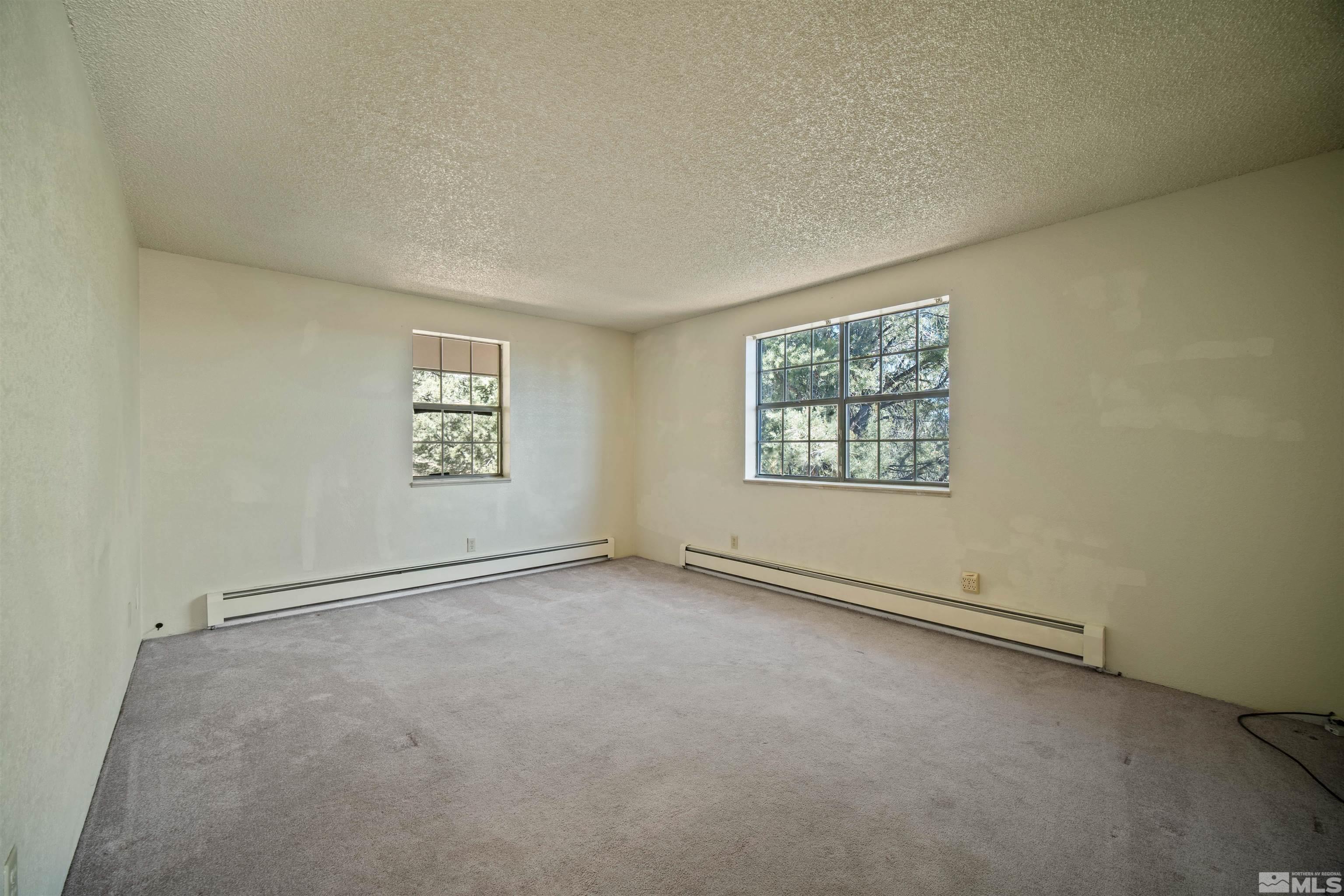 1960 Silverado Road Reno, NV 89521 - Photo 15 of 39 an empty room with windows