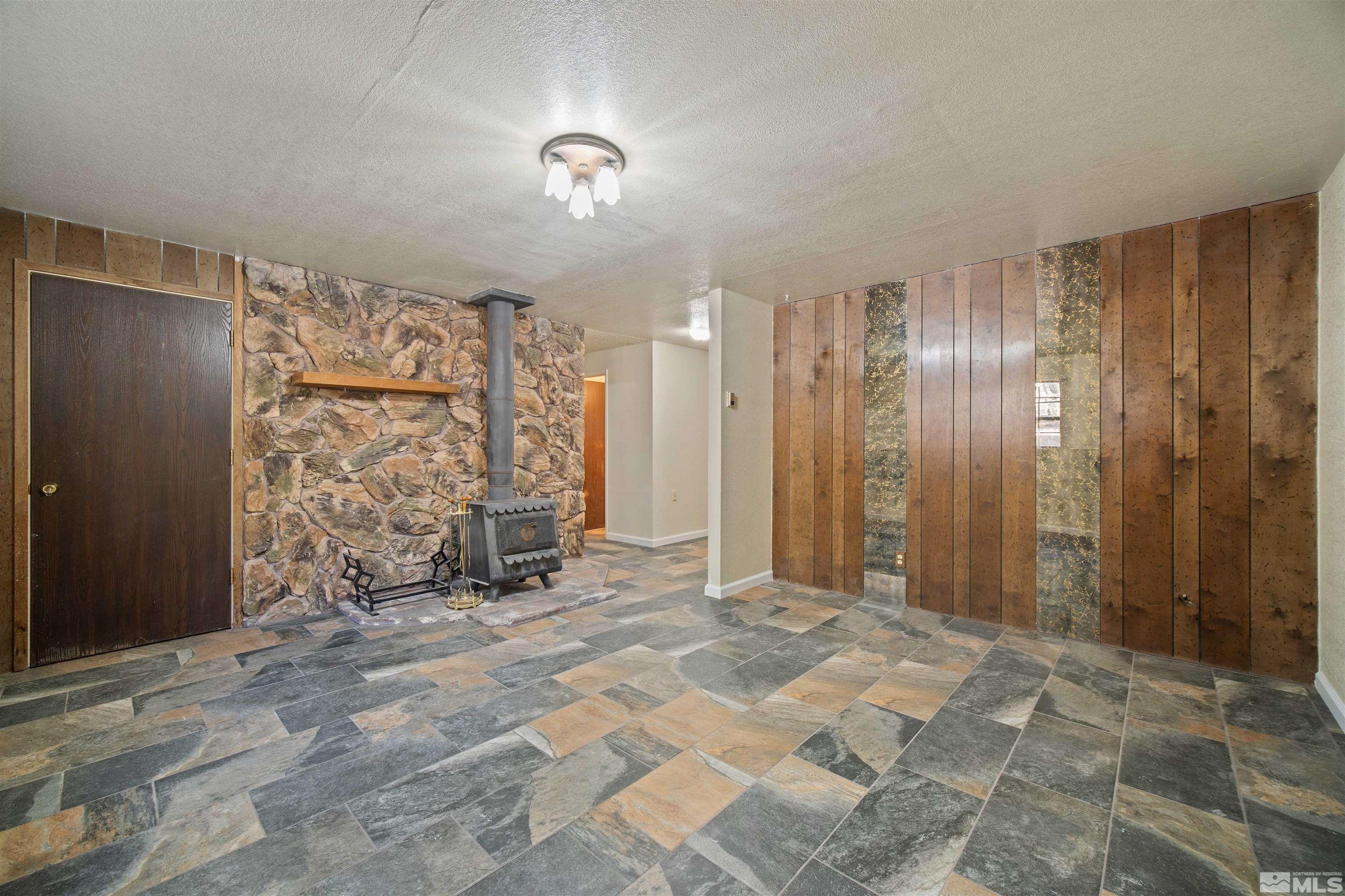1960 Silverado Road Reno, NV 89521 - Photo 24 of 39 a view of a empty room with a fireplace