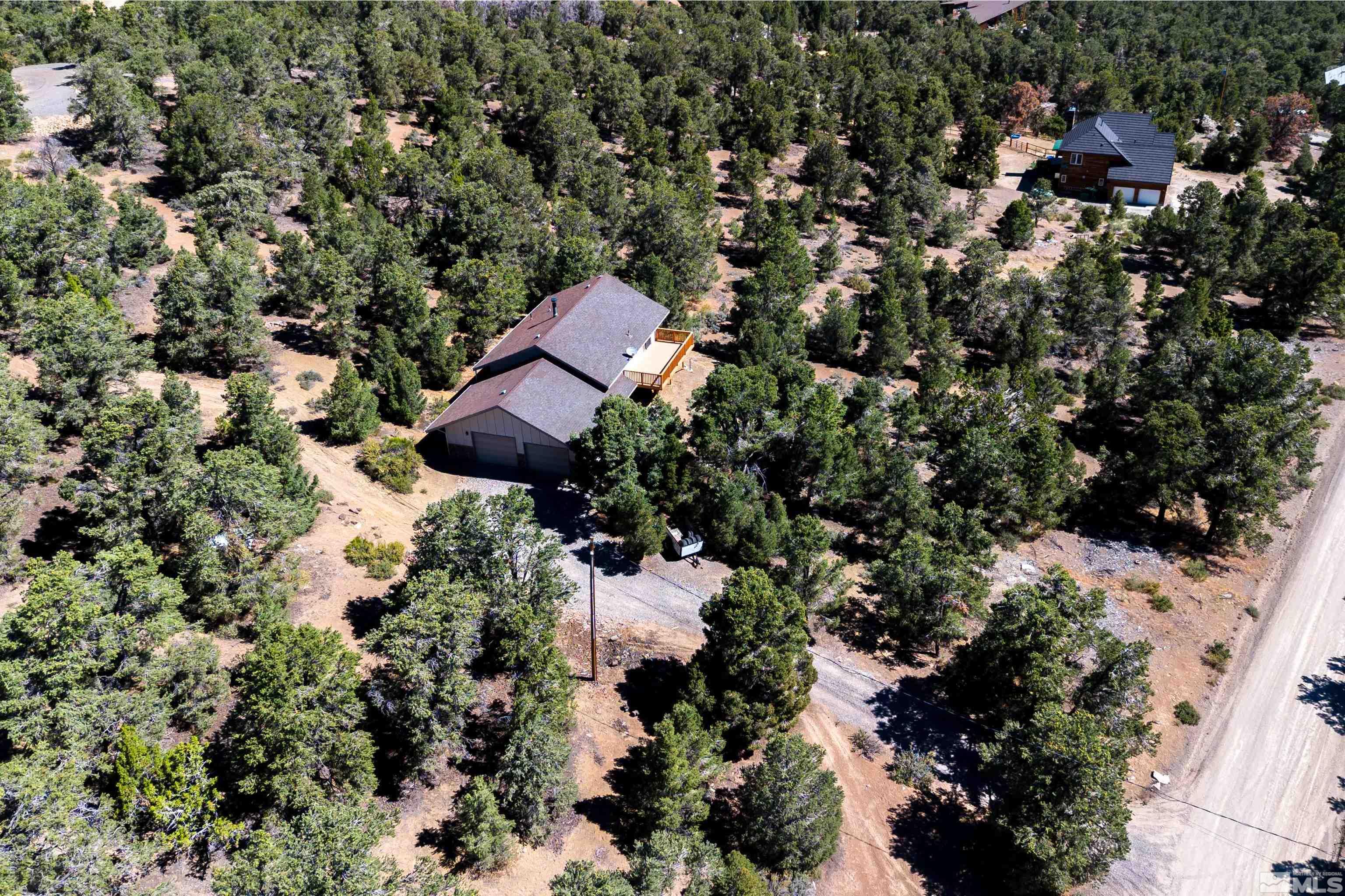 1960 Silverado Road Reno, NV 89521 - Photo 32 of 39 an aerial view of residential house with outdoor space and trees all around