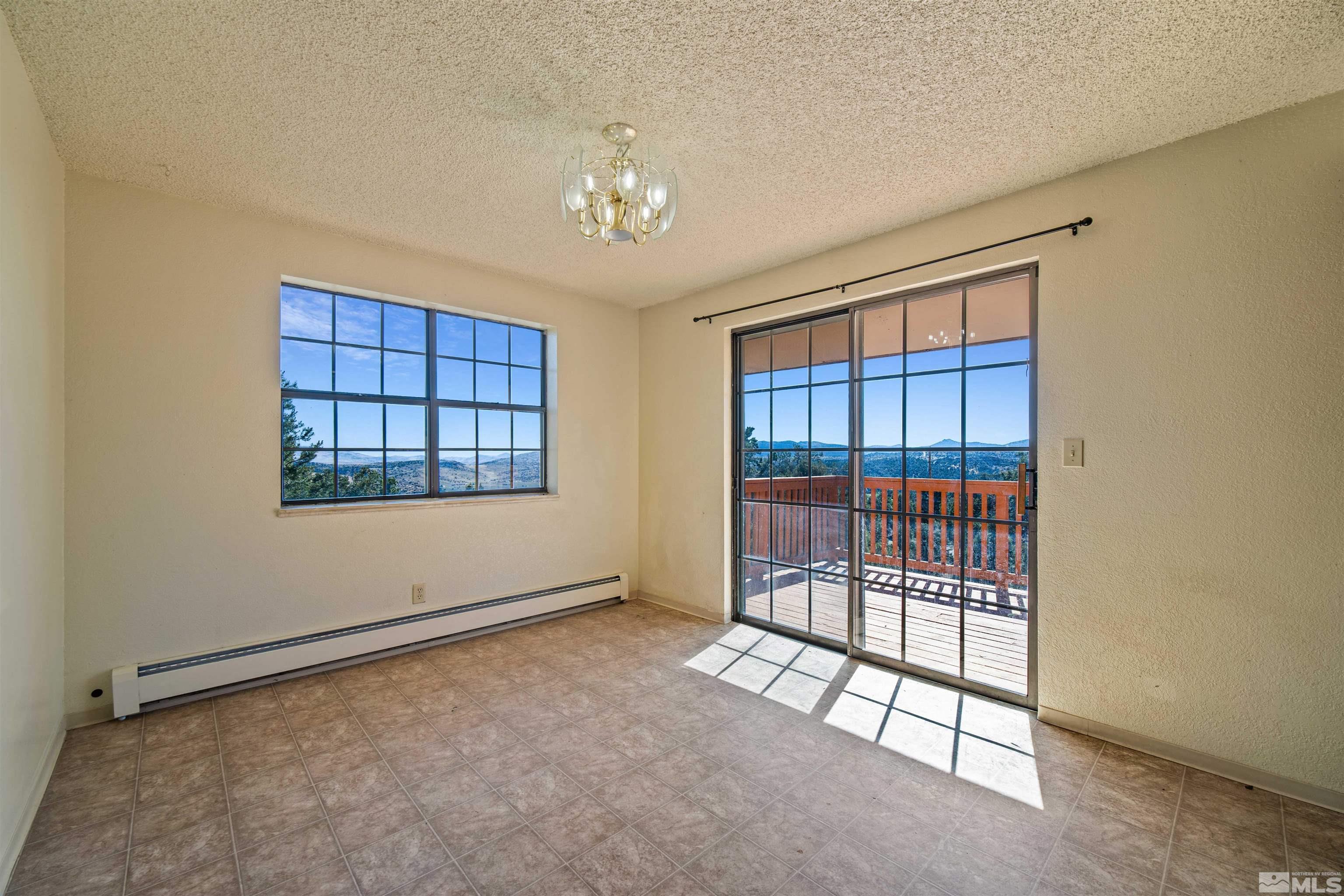 1960 Silverado Road Reno, NV 89521 - Photo 8 of 39 a view of an empty room with a window
