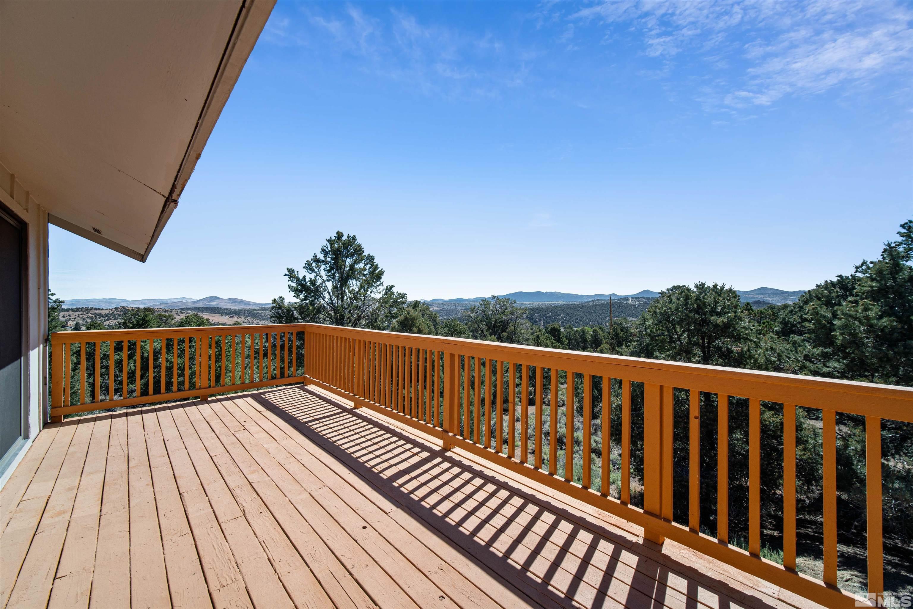 1960 Silverado Road Reno, NV 89521 - Photo 10 of 39 a view of balcony with wooden floor and fence
