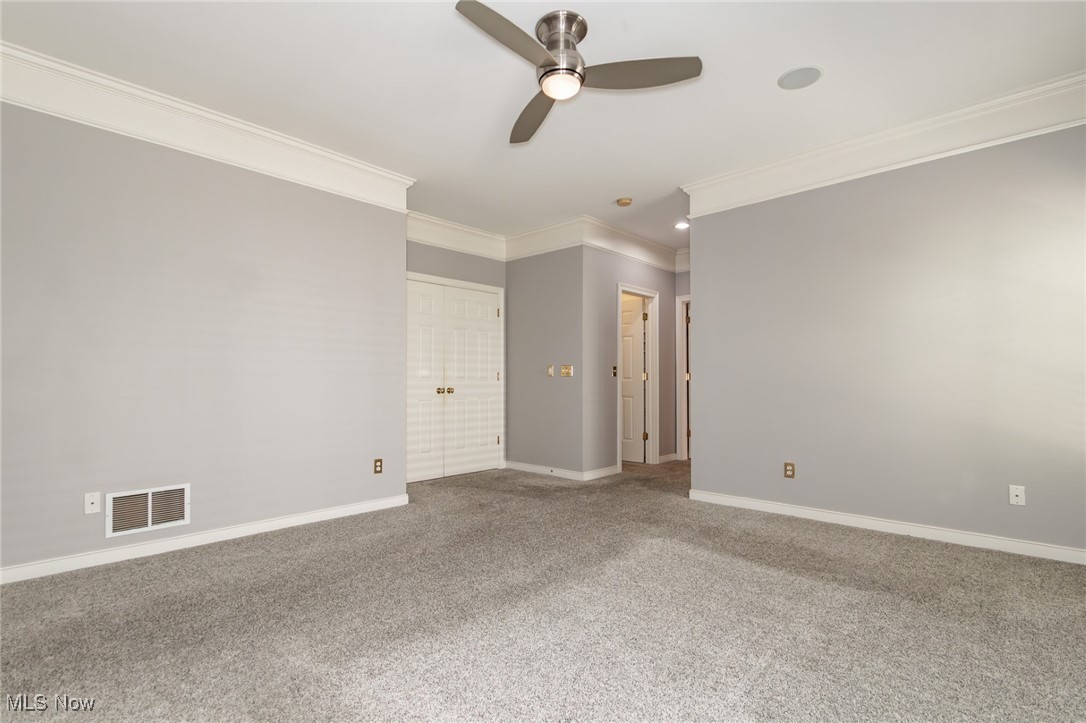 293 Burwick Road Cleveland, OH 44143 - Photo 16 of 50 First floor owner's suite with crown molding, ceiling fan, two walk in closets and en-suite bath!