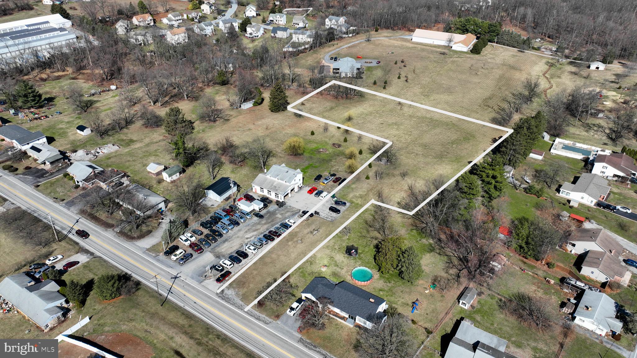 an aerial view of a residential houses with outdoor space