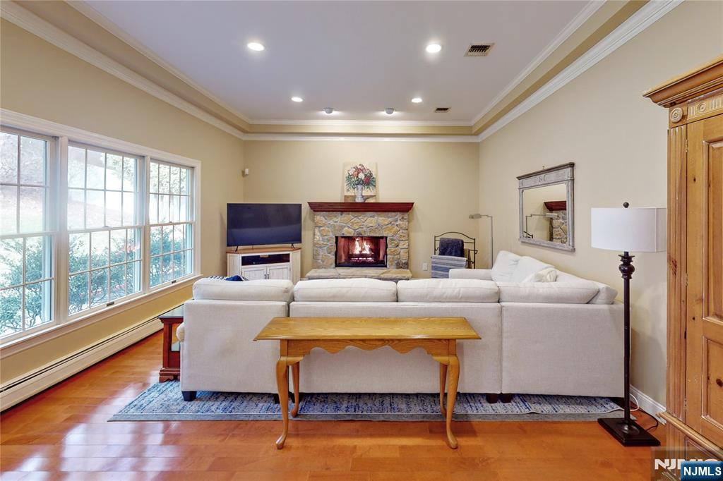 10 Hope Street Montvale, NJ 07645 - Photo 12 of 44 a living room with furniture and a flat screen tv