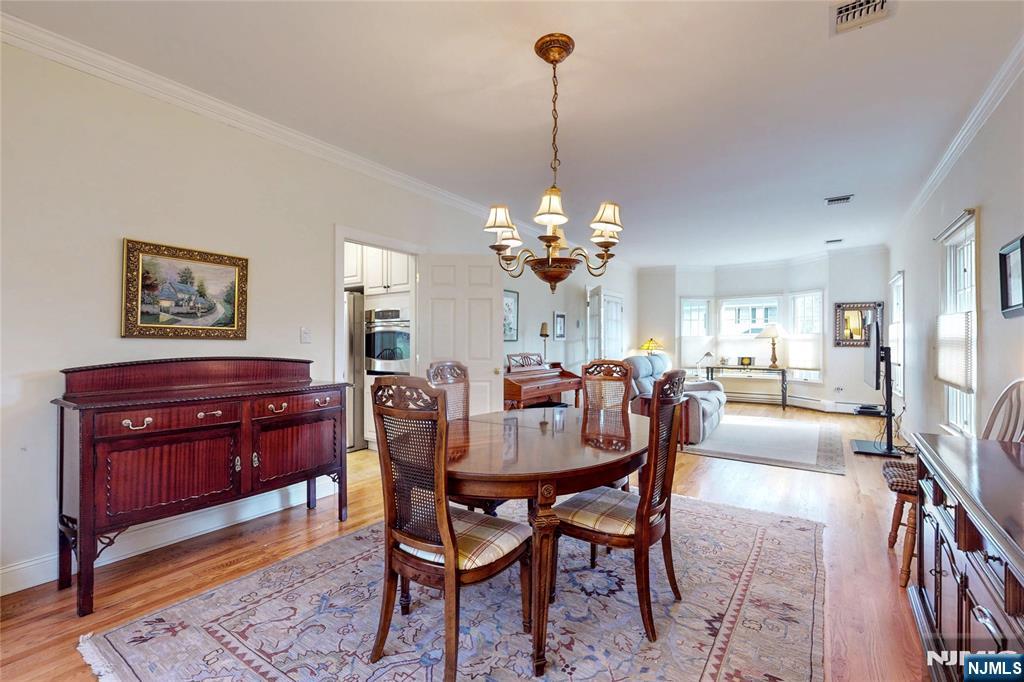 10 Hope Street Montvale, NJ 07645 - Photo 14 of 44 a view of a dining room with furniture and chandelier