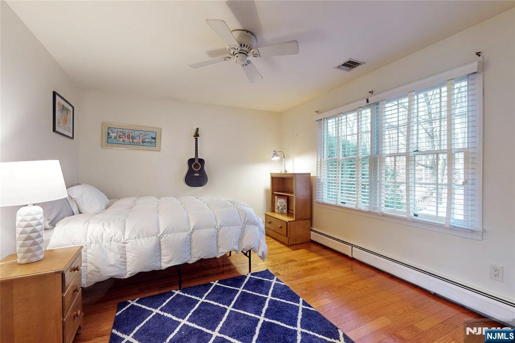 10 Hope Street Montvale, NJ 07645 - Photo 28 of 44 a bedroom with a bed and wooden floor