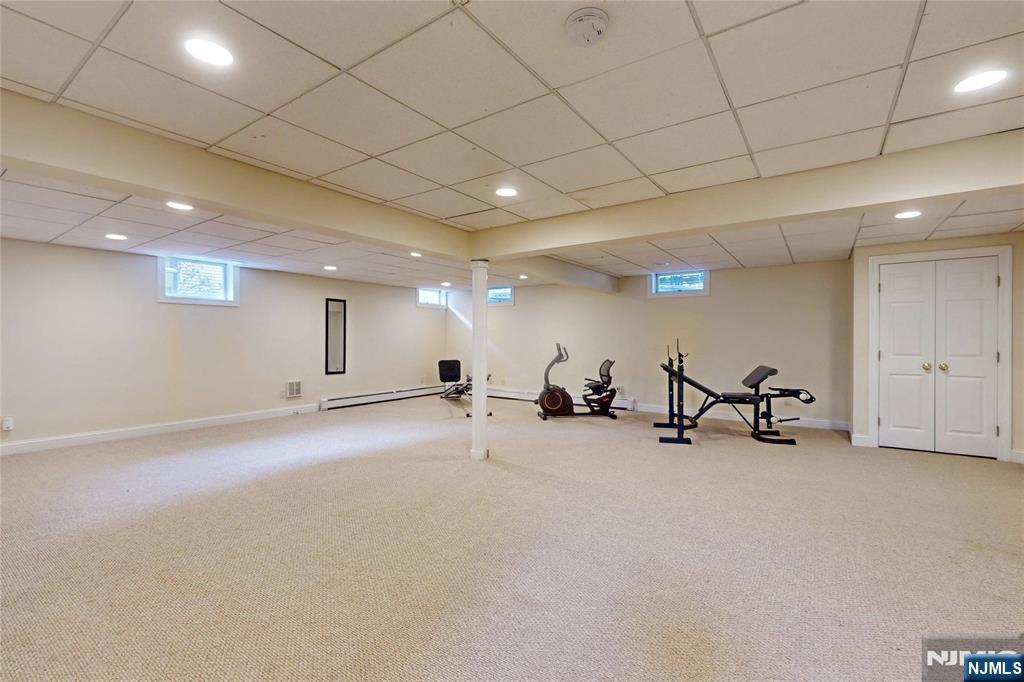 10 Hope Street Montvale, NJ 07645 - Photo 32 of 44 a view of a room with gym equipment and wooden floor