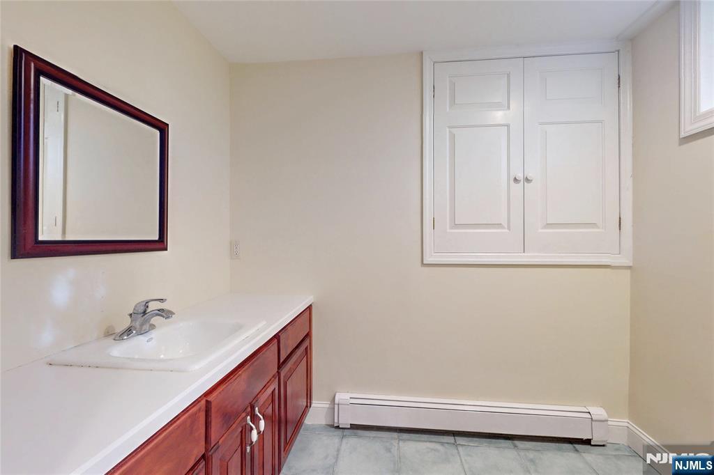 10 Hope Street Montvale, NJ 07645 - Photo 34 of 44 a bathroom with a sink and a mirror