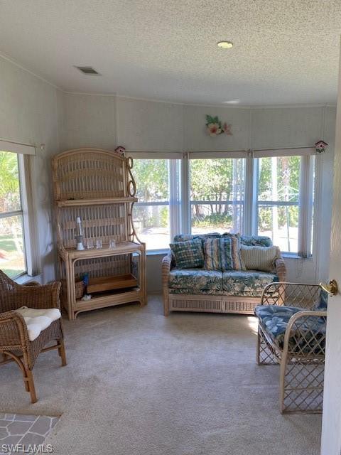 222 Riverwood Road Naples, FL 34114 - Photo 11 of 23 a living room with furniture and a window