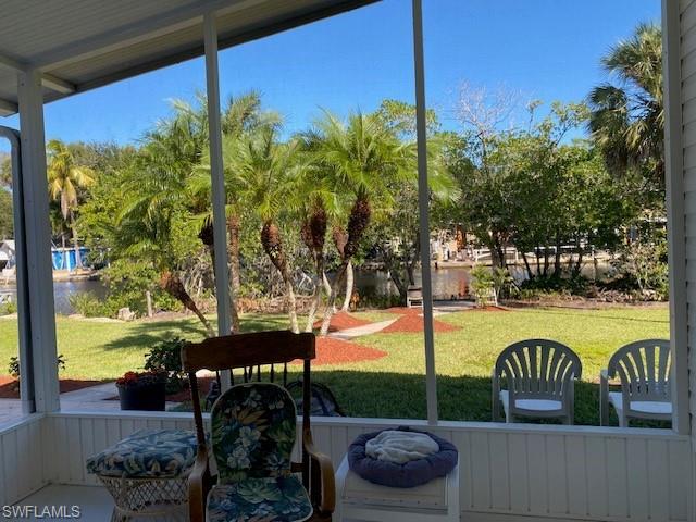 222 Riverwood Road Naples, FL 34114 - Photo 14 of 23 a view of a swimming pool with a patio