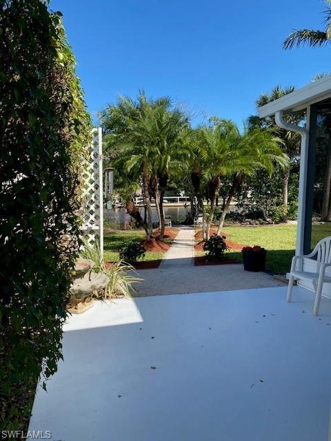 222 Riverwood Road Naples, FL 34114 - Photo 16 of 23 a view of a street with a slide