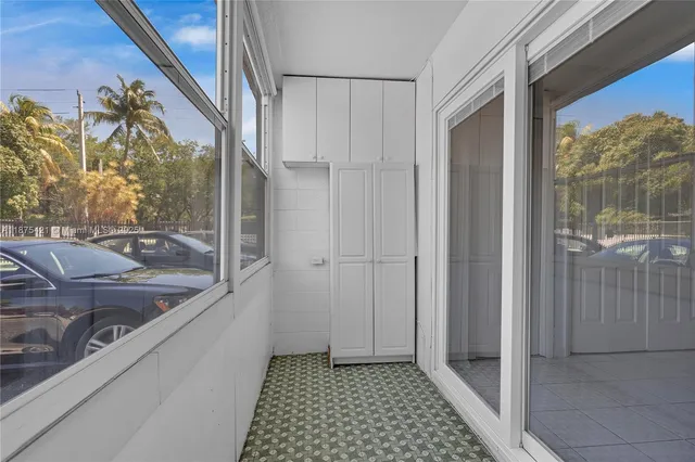 a view of a bathroom with a sink and glass door
