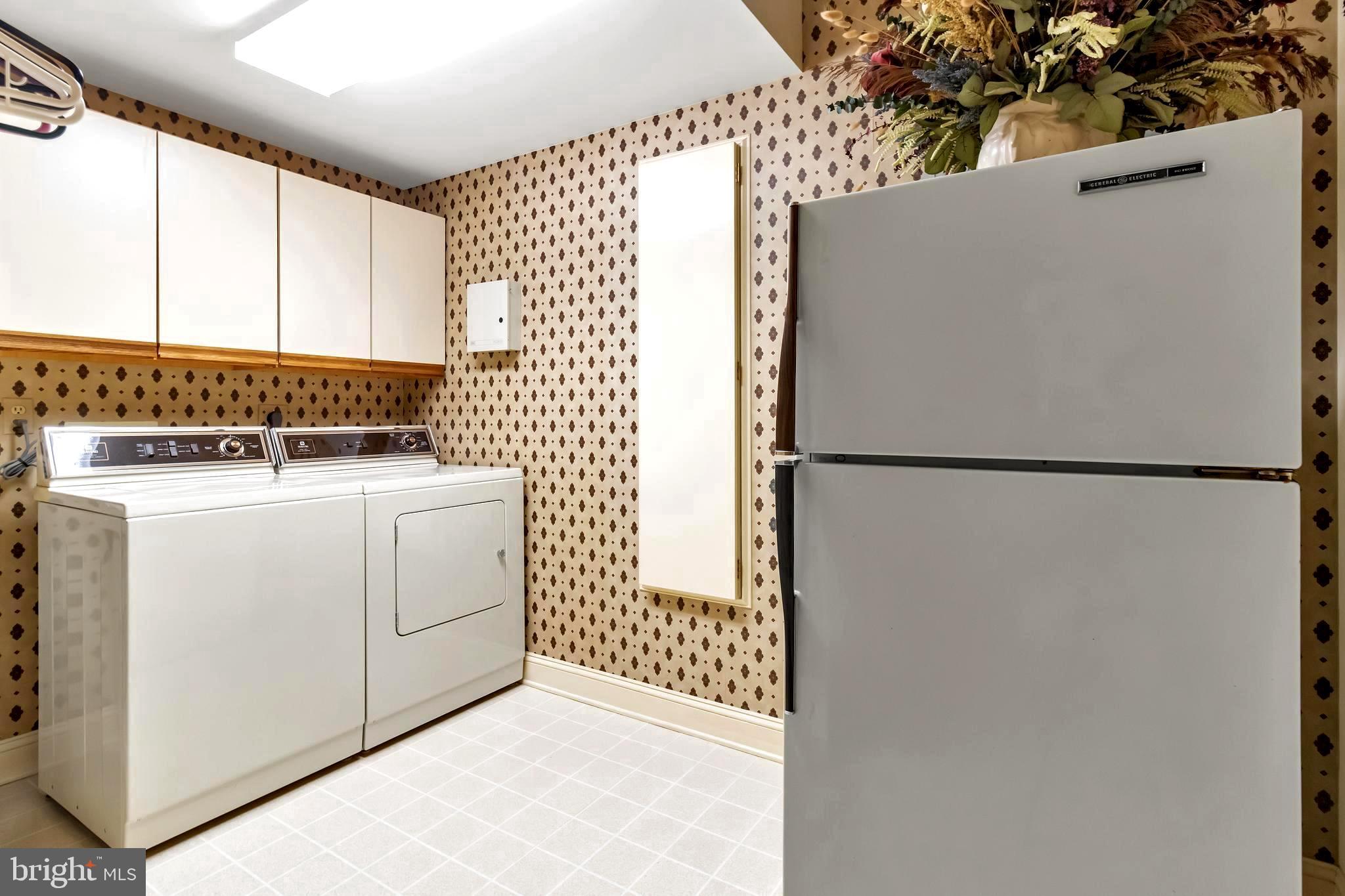 1070 South River Landing Road Edgewater, MD 21037 - Photo 54 of 64 Laundry Room with Storage and Fridge