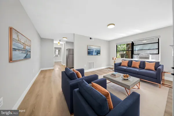 a living room with furniture and a large window