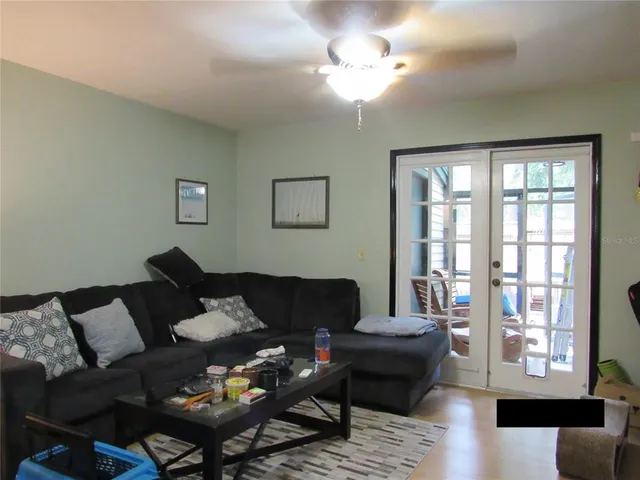 a living room with furniture and a window