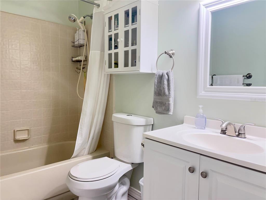 5216 Southwest 92nd Court Gainesville, FL 32608 - Photo 23 of 32 a bathroom with a sink toilet and shower