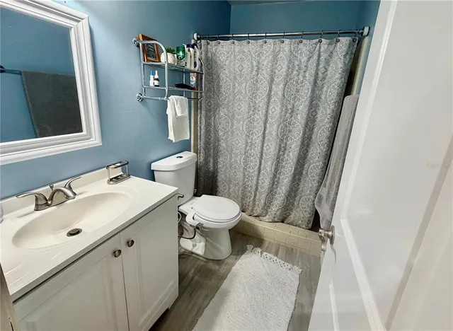 a bathroom with a sink and toilet