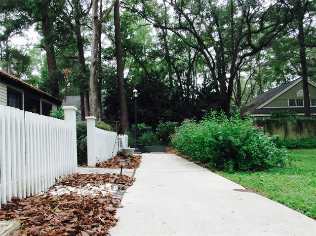 a view of a house with a small yard