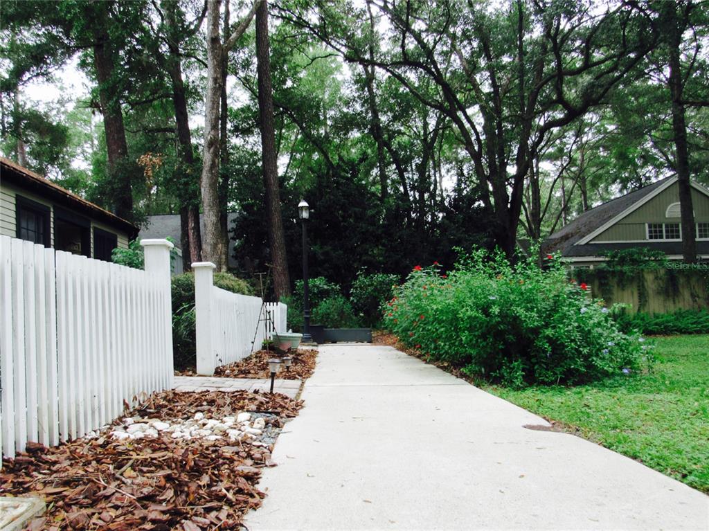 5216 Southwest 92nd Court Gainesville, FL 32608 - Photo 3 of 32 a view of a house with a small yard