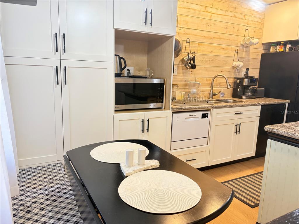 5216 Southwest 92nd Court Gainesville, FL 32608 - Photo 10 of 32 a bathroom with a sink and a mirror