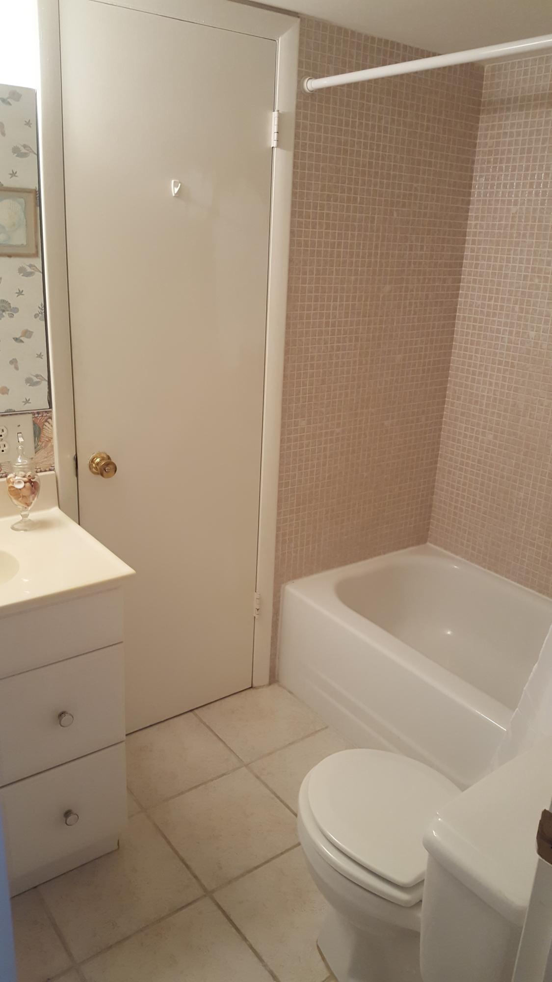 1931 Southwest Palm City Road, Unit D Stuart, FL 34994 - Photo 7 of 18 Tile bathroom
