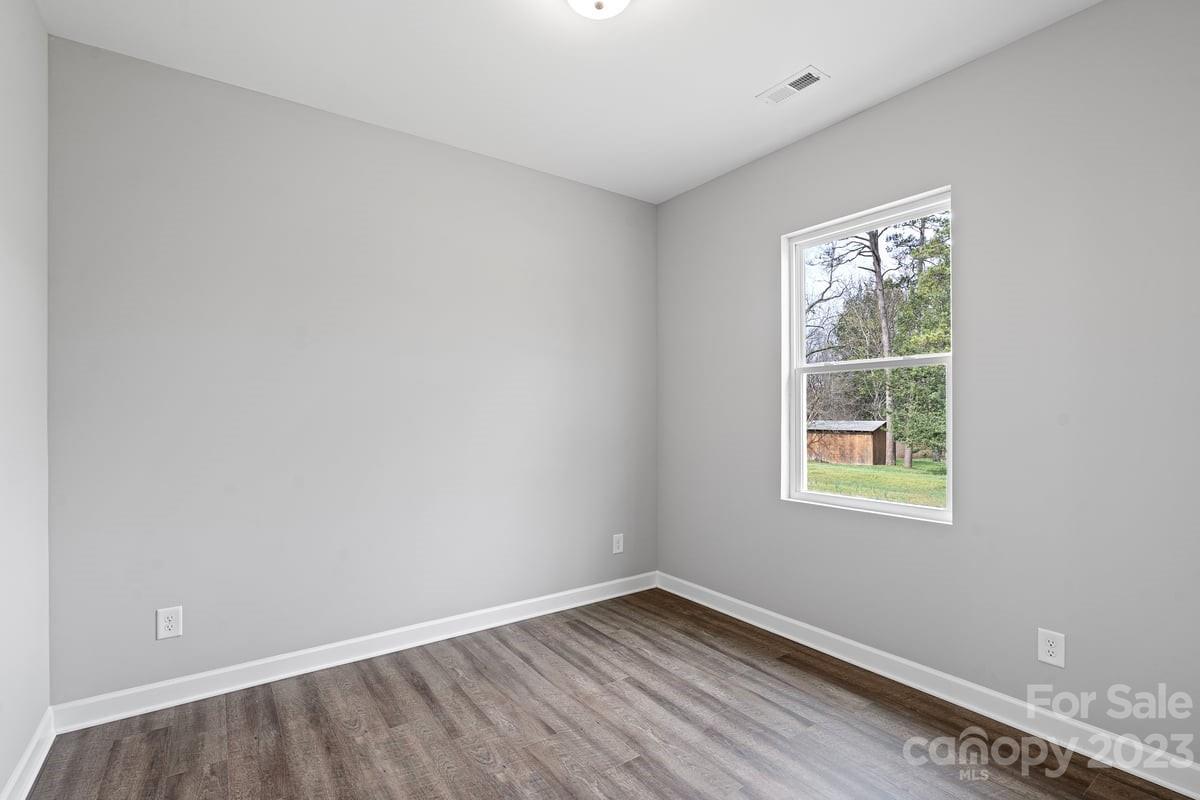 422 Queens Road Gastonia, NC 28052 - Photo 12 of 18 an empty room with a window