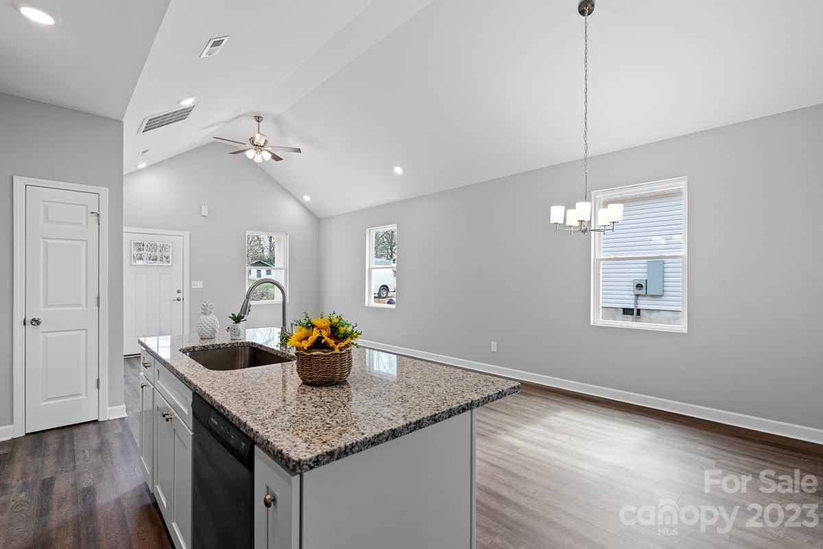 422 Queens Road Gastonia, NC 28052 - Photo 4 of 18 a kitchen with a sink a counter space and wooden floor