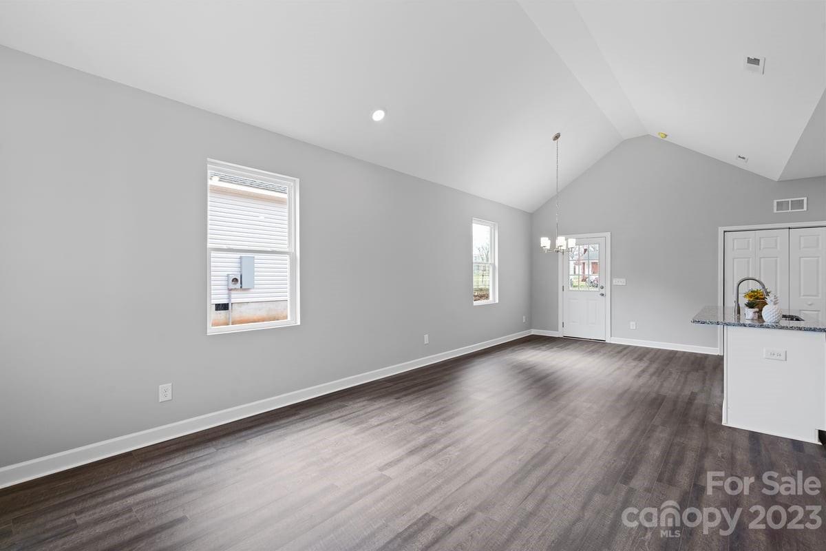 422 Queens Road Gastonia, NC 28052 - Photo 7 of 18 wooden floor in an empty room with a window