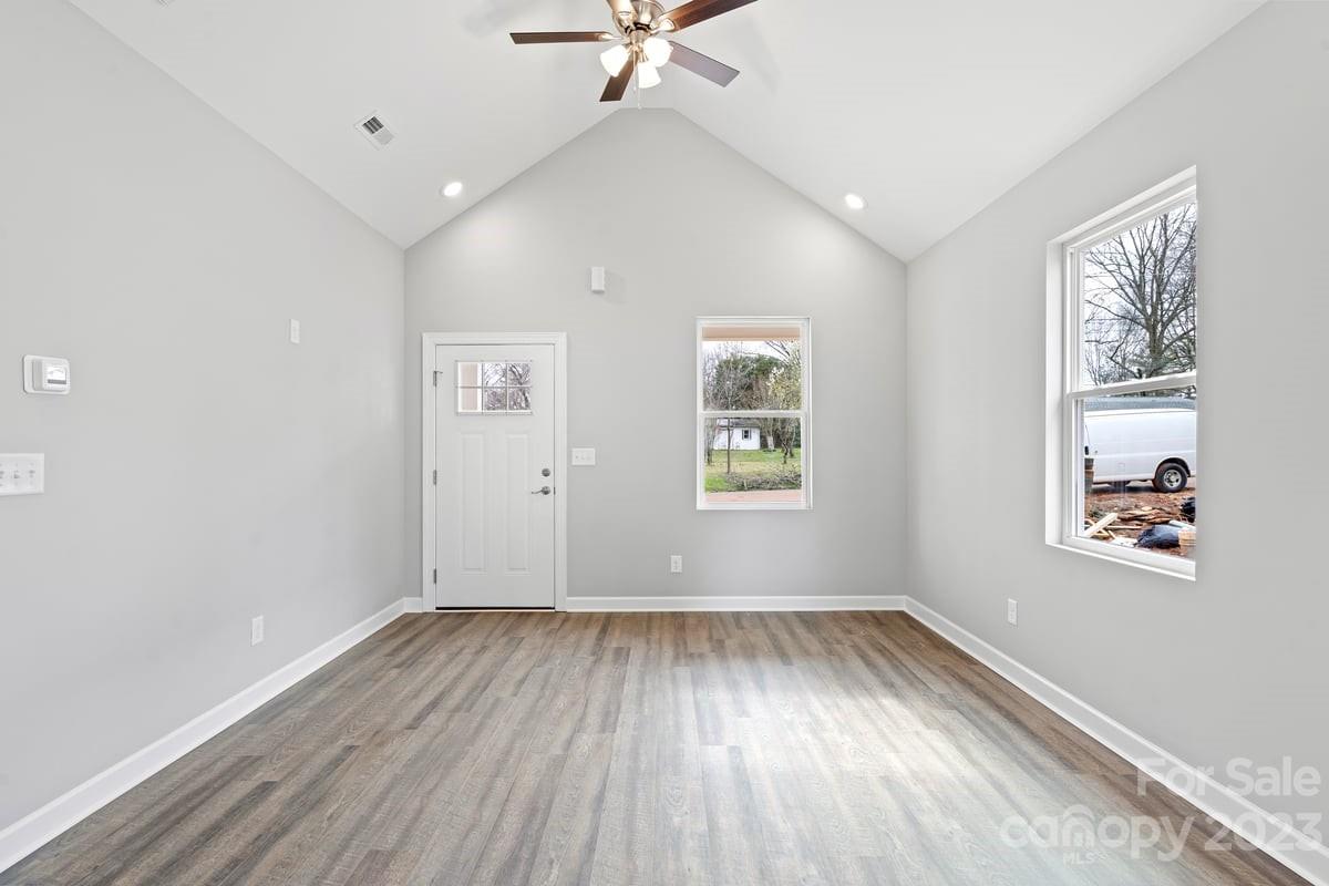 422 Queens Road Gastonia, NC 28052 - Photo 9 of 18 wooden floor in an empty room with a window