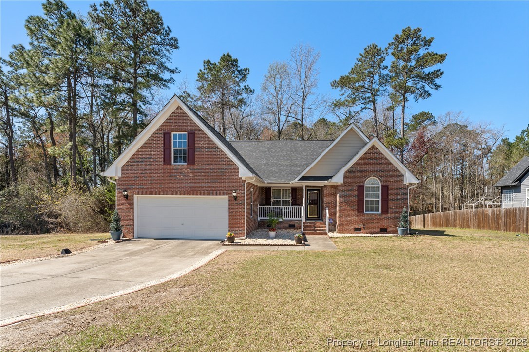 292 Falling Leaf Drive Raeford, NC 28376 - Photo 1 of 40 a front view of a house with a yard